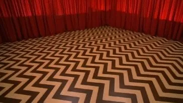 chevron floor and red drapes in the black lodge