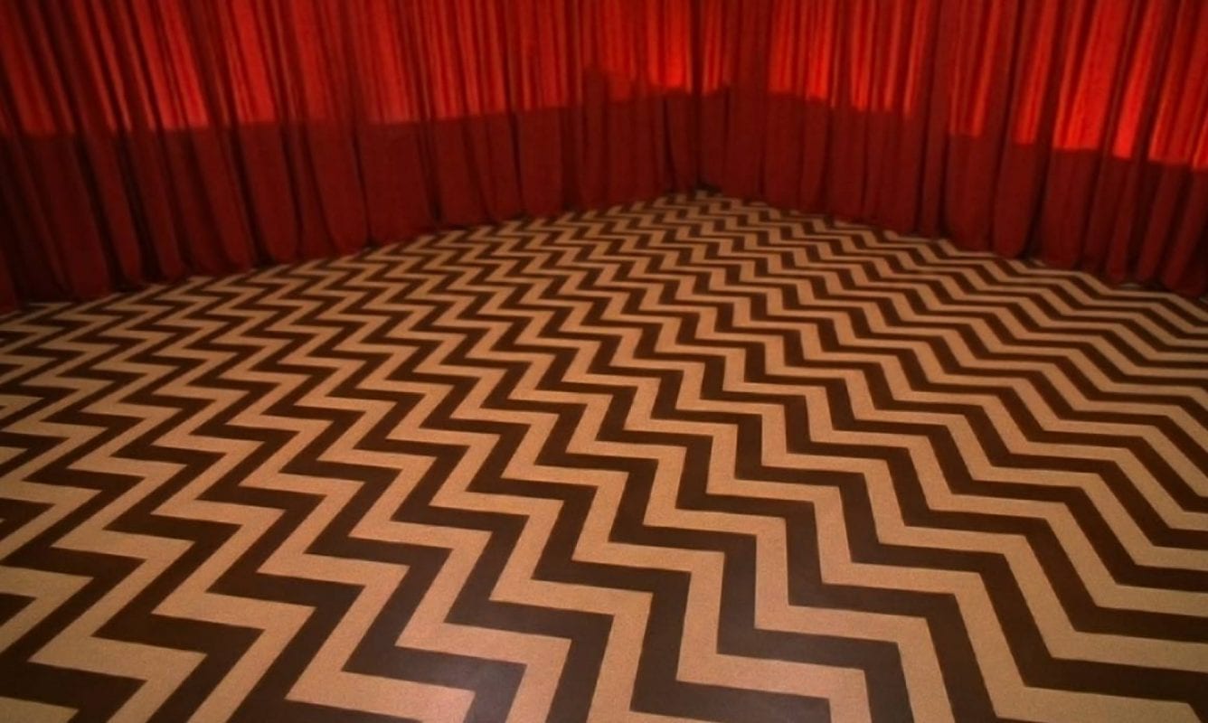 chevron floor and red drapes in the black lodge
