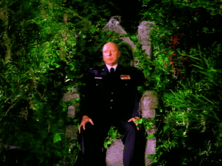 Major Briggs vision of himself sitting on a throne covered in greenery