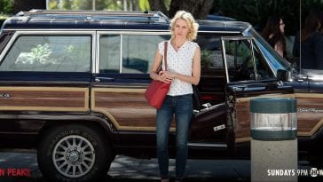 Janey E stands by her SUV like a boss