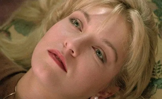 Laura Palmer lays back on her sofa