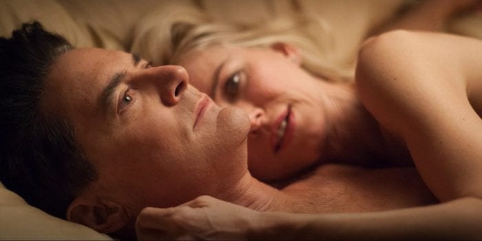 Cooper and Janey-E lie in bed together cuddling after sex
