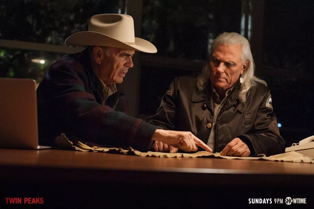 Frank Truman and Hawk look at the living map