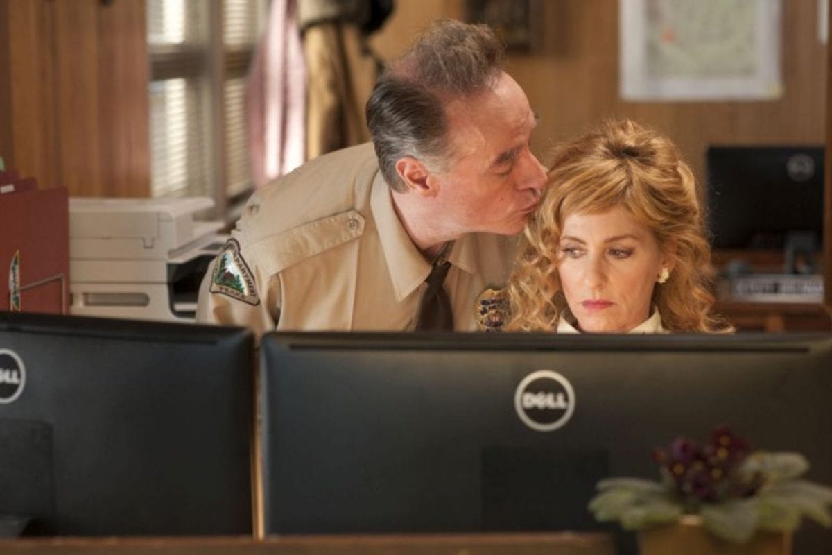 Andy kisses lucy on the head at the twin peaks sheriffs station