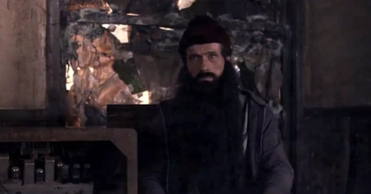 woodsman FWWM A woodsman sits next to an electric machine in FWWM