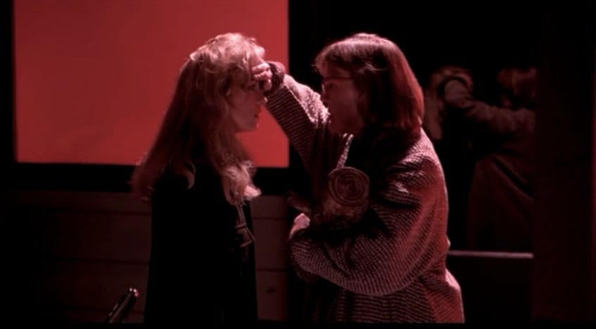the log lady touches the forehead of Laura Palmer out of concern