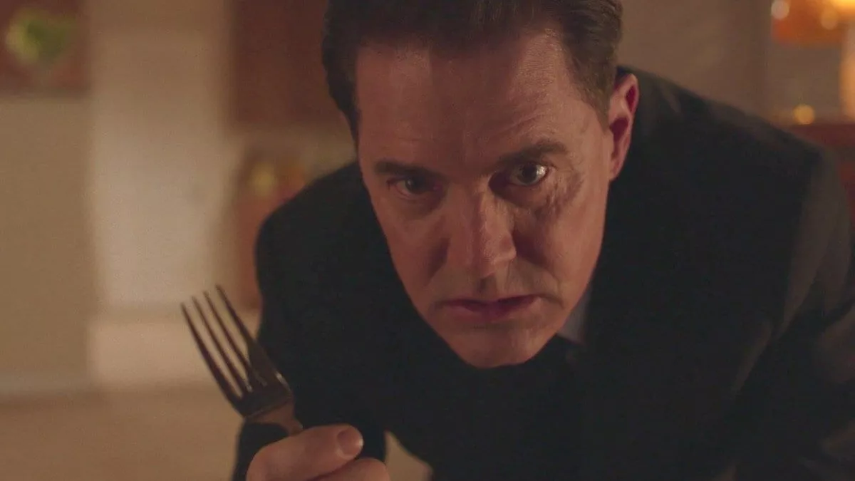 Cooper with a fork in his hand