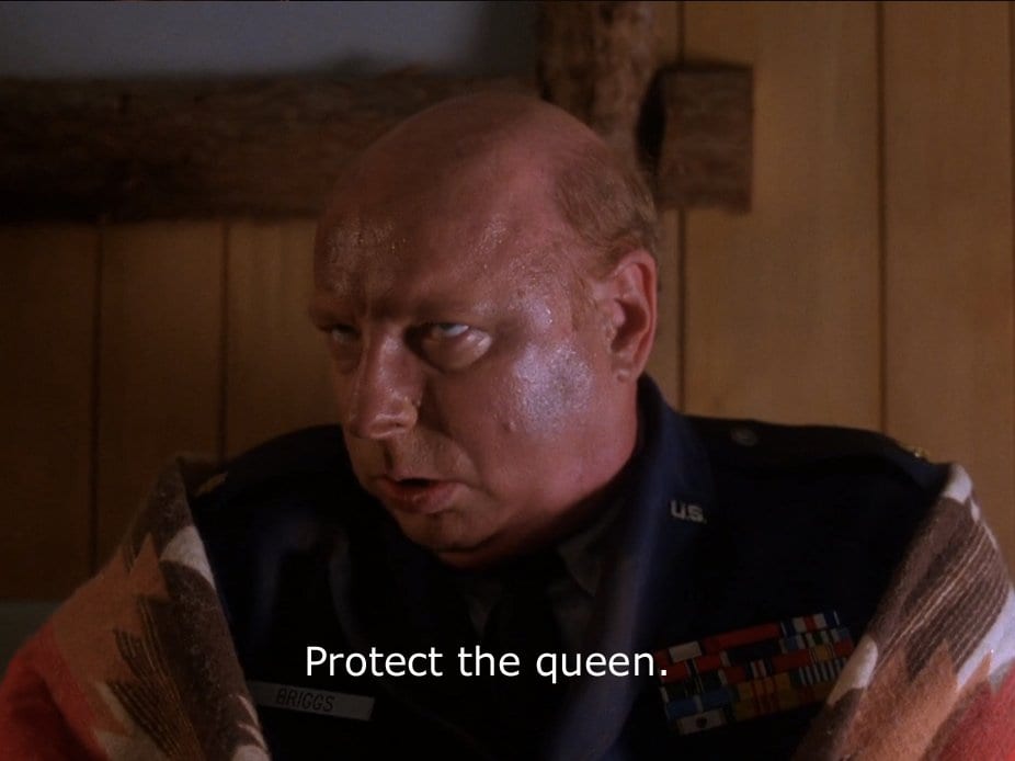 Briggs tells Cooper to protect the queen
