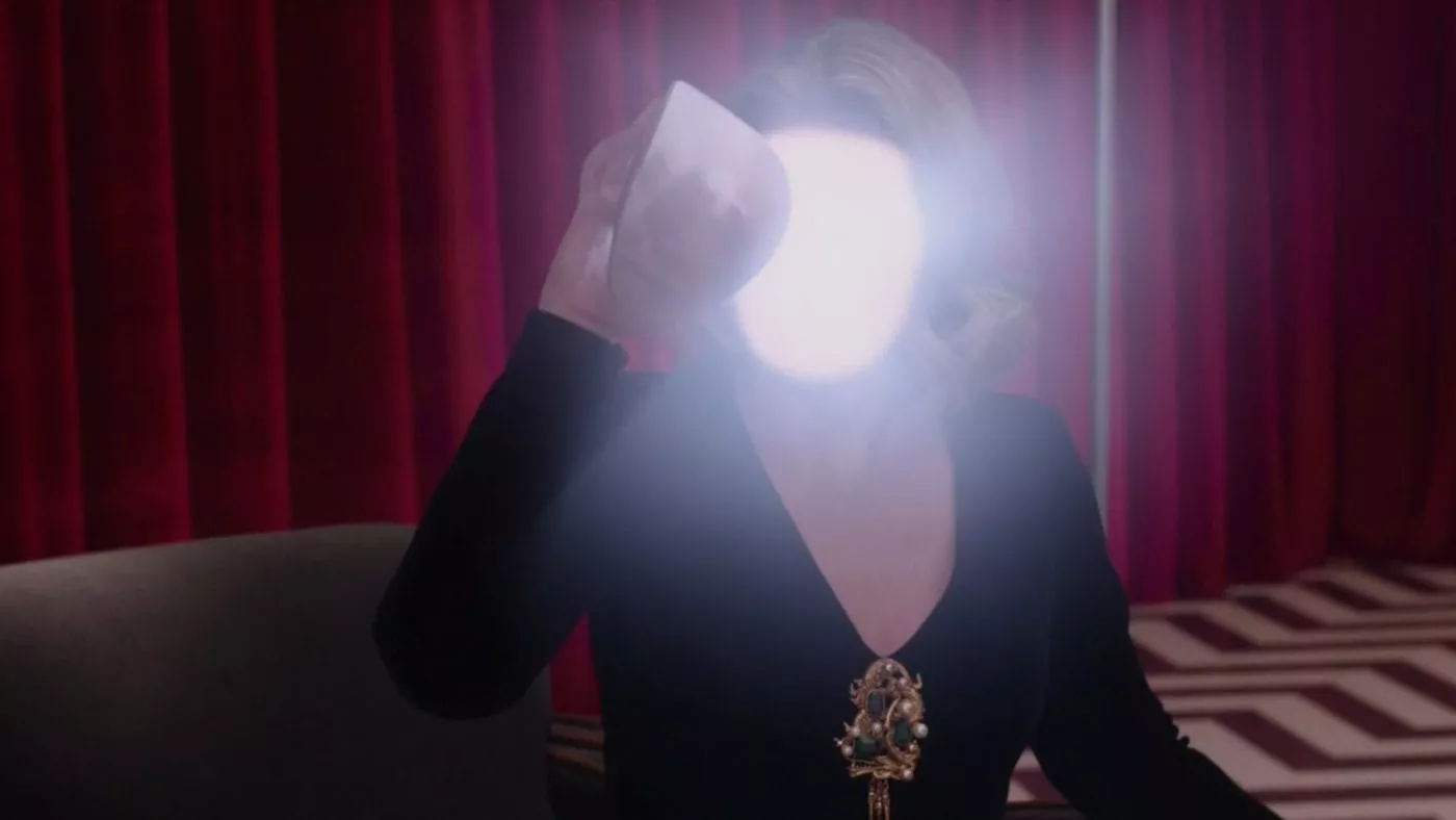 Laura Palmer removes her face to reveal a bright white light