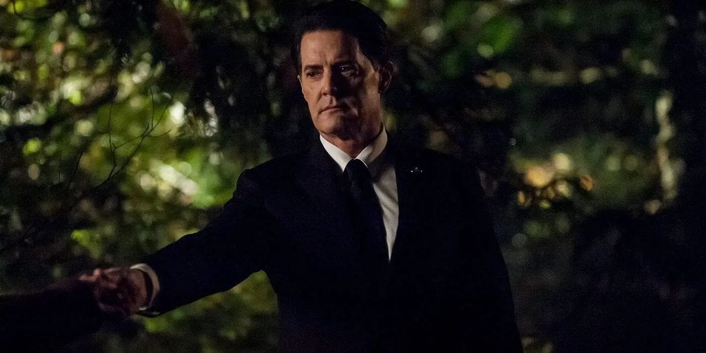 Agent Cooper extends his hand to Laura Palmer