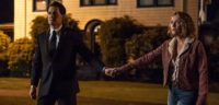 Dale Cooper and Carrie Page hold hands and walk towards the Palmer house
