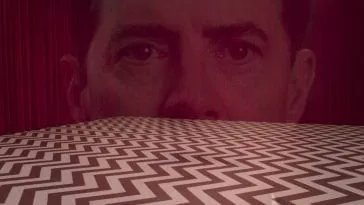 dale coopers face superimposed over the red room