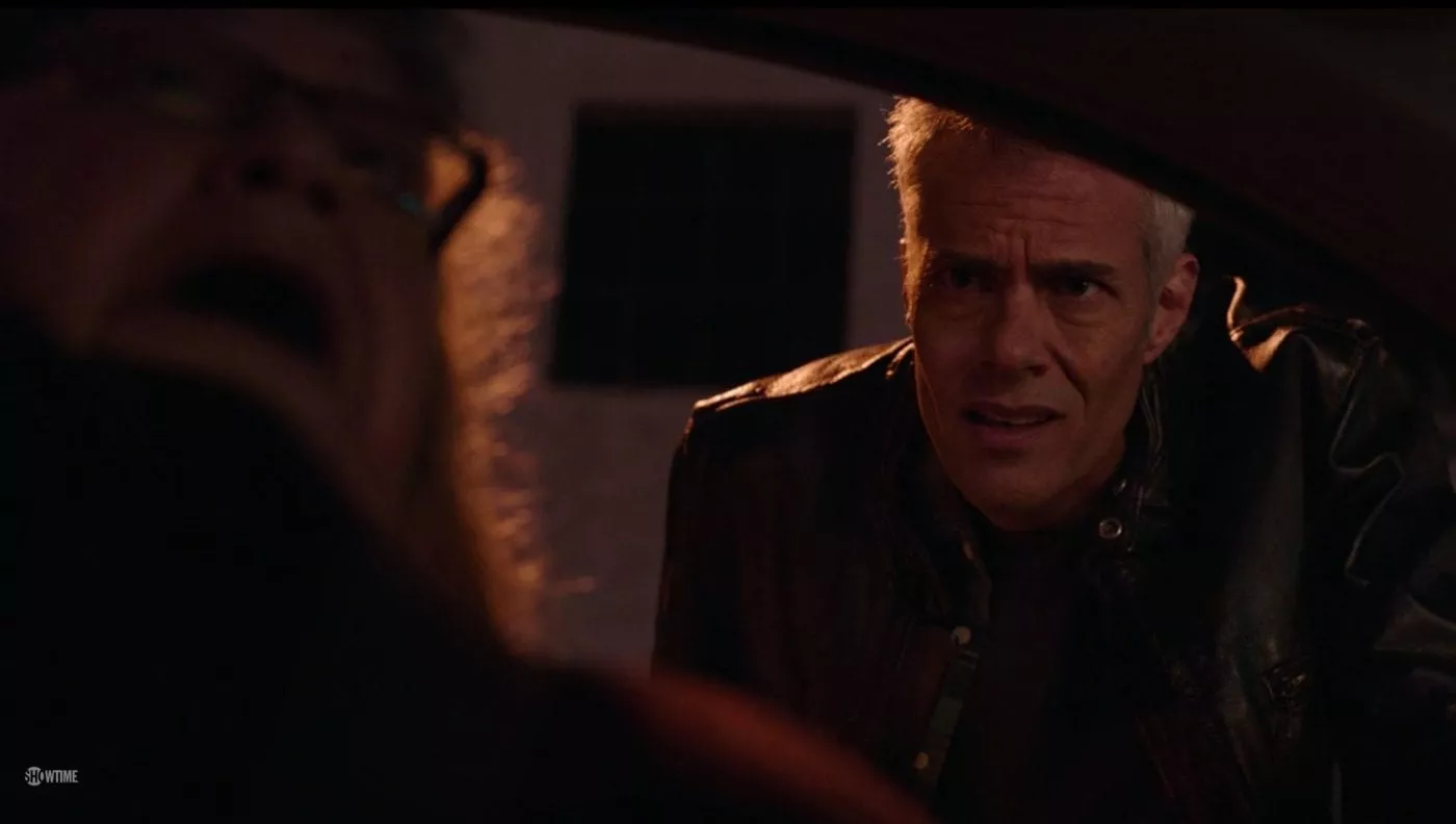 Bobby looks in a car after gunfire outside the Double R