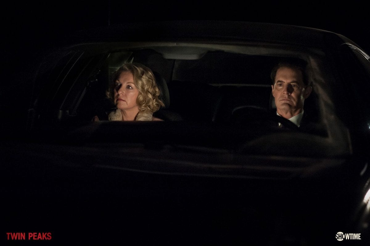 Cooper and Carrie ride in a car together at night