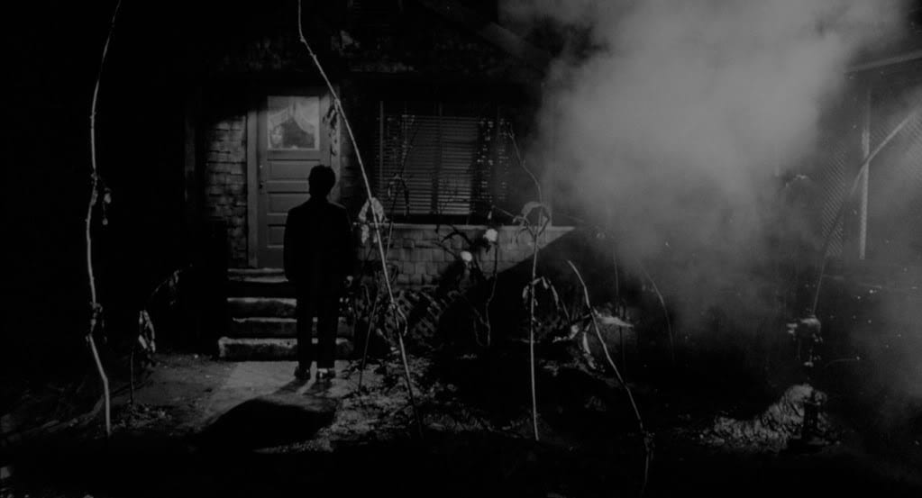 Mary's House in Eraserhead with smoke billowing outside