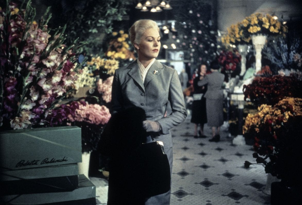 a platinum blonde woman in a florist in Vertigo
