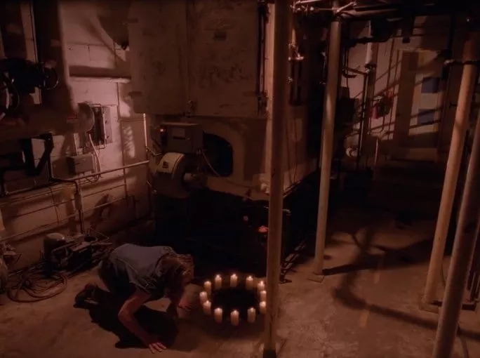 12 candles burning in a circle with BOB