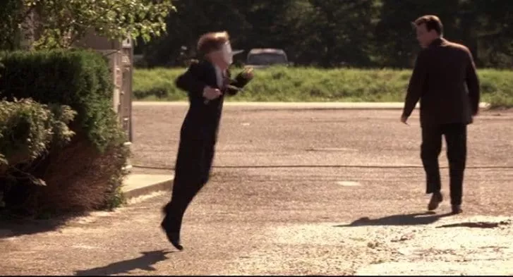 The grandson jumps with glee outside the Red Diamond Motel