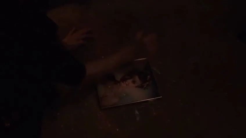 Sarah Palmer tries to smash the picture of her daughters prom photo but it won't break