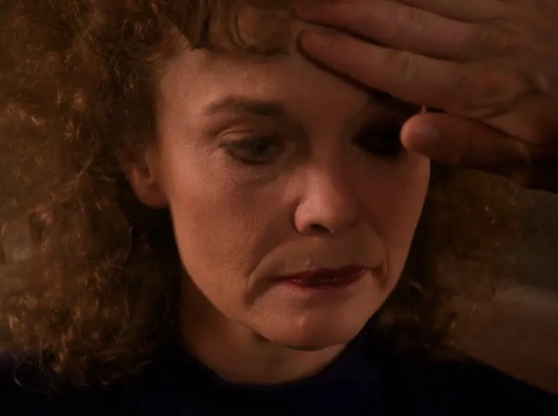 Sarah Palmer Cooper feels Sarah Palmers forehead