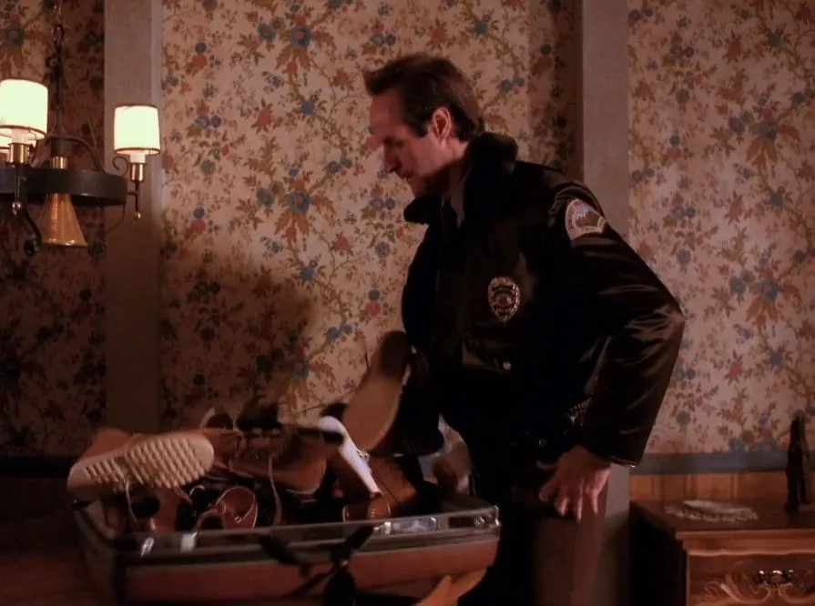 Andy finds a suitcase full of shoes