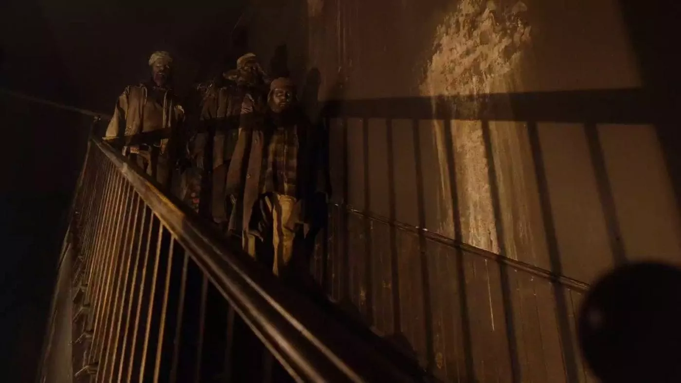 The Woodsmen stand at the top of the stairs of the convenience store