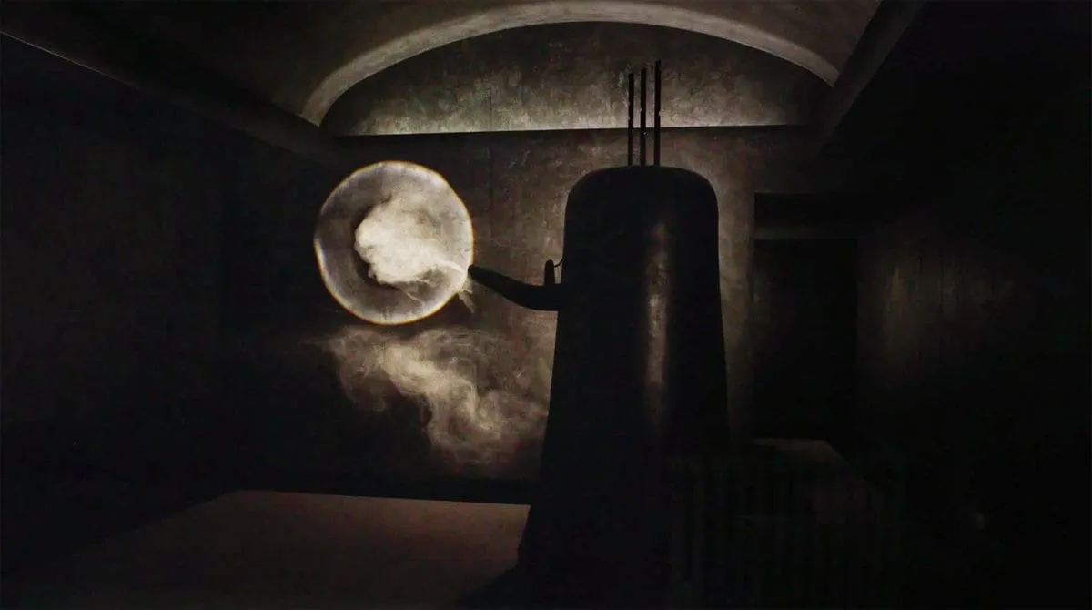 a kettle shaped object bellowing smoke out of it