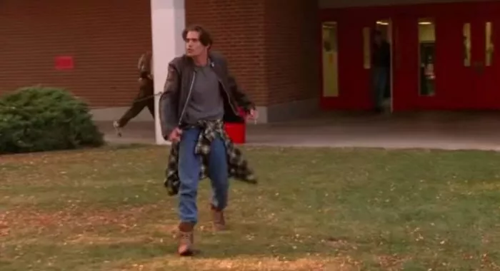 Bobby Briggs, dancing backwards towards the school door