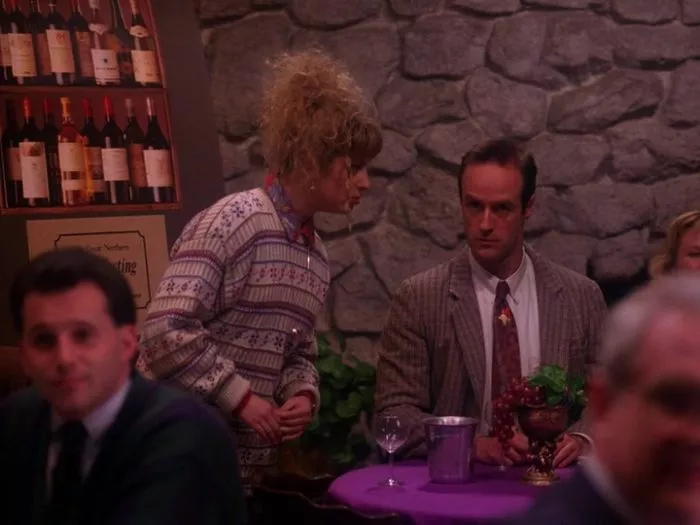 Lucy speaks to Andy at his table