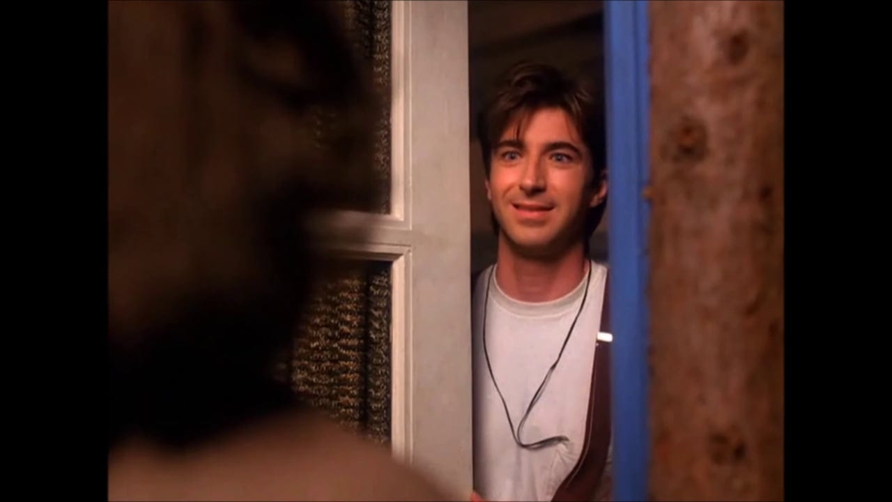 Harold Smith smiles as he opens his door to Donna