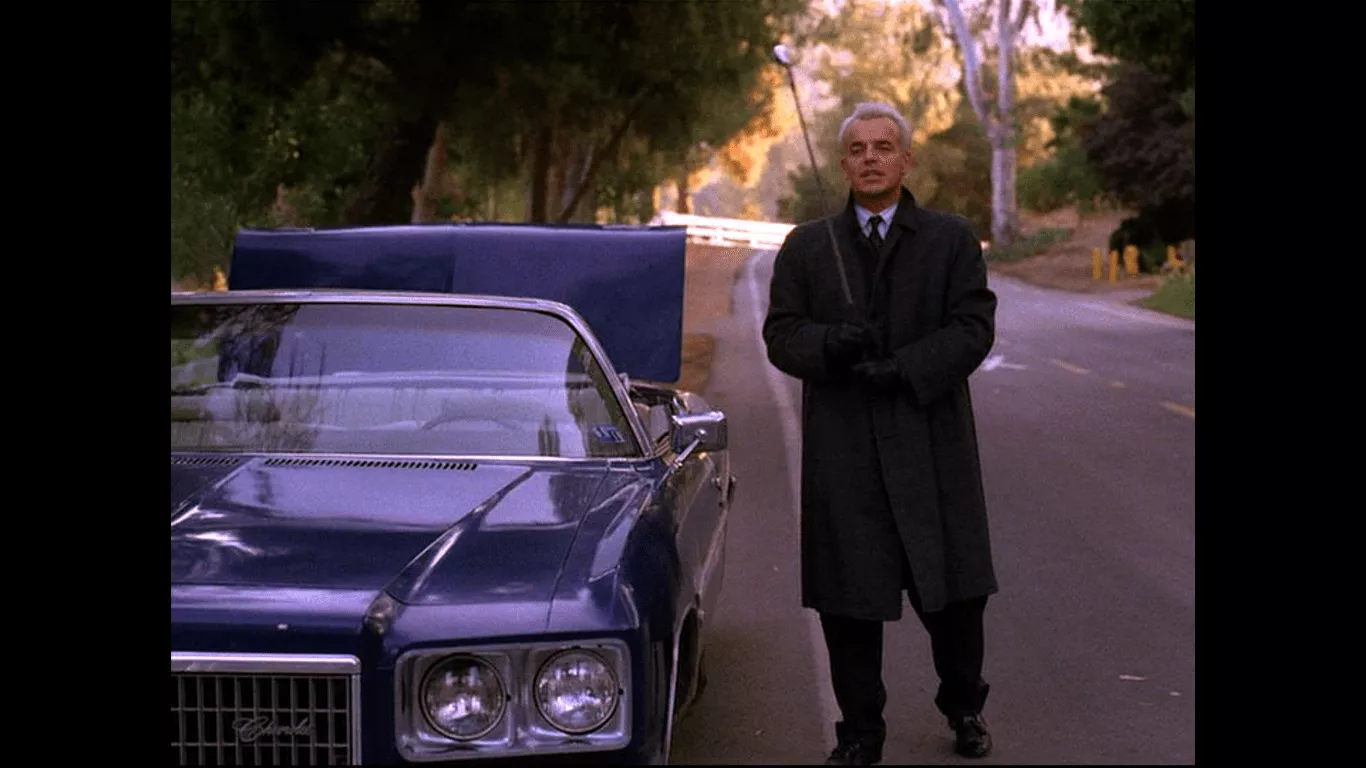 Ray Wise as Leland Palmer Ray Wise as Leland Palmer raising a golf club in the air