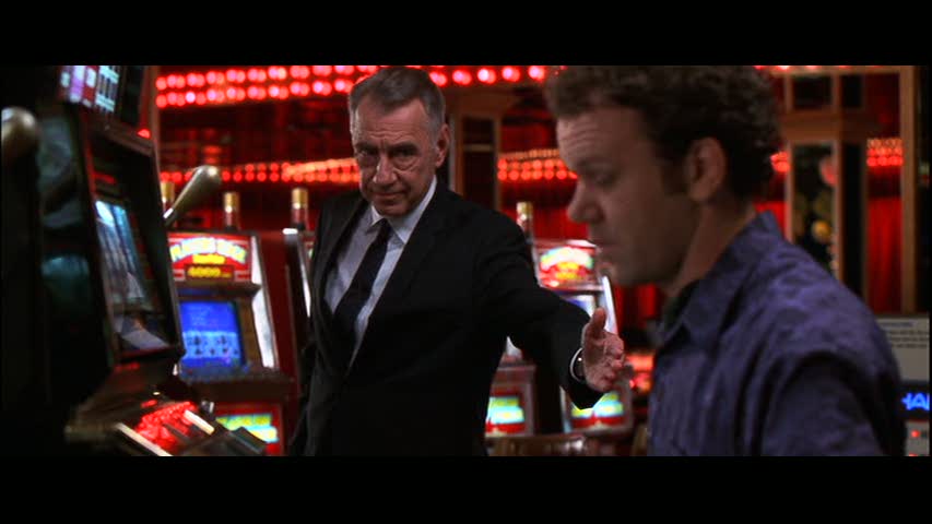 Phillip Baker Hall reaches a hand out to John C Reilly in a casino in Hard Eight