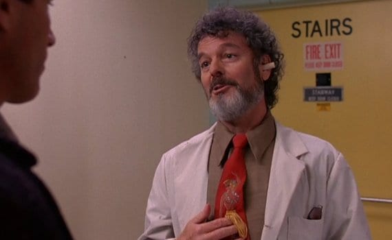 Dr. Jacoby in front of a door to the stairs in the hospital