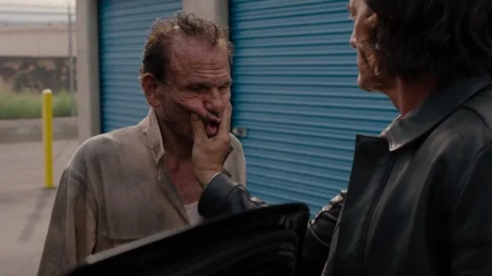 Mr C squashes the face of Jack the mechanic in Twin Peaks