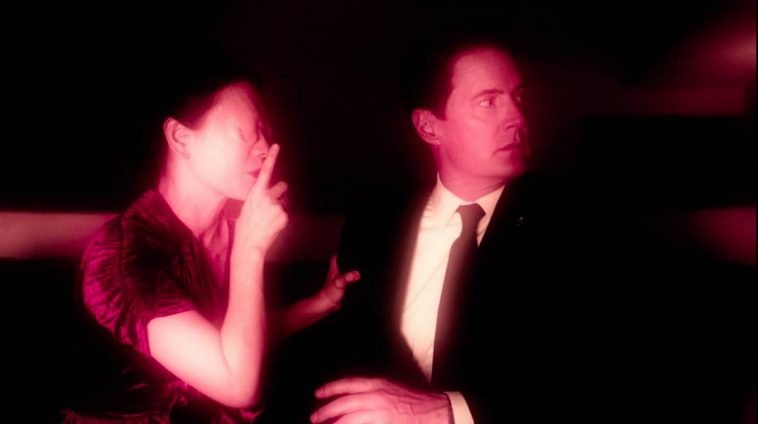 naido puts a finger to her mouth telling cooper to be quiet