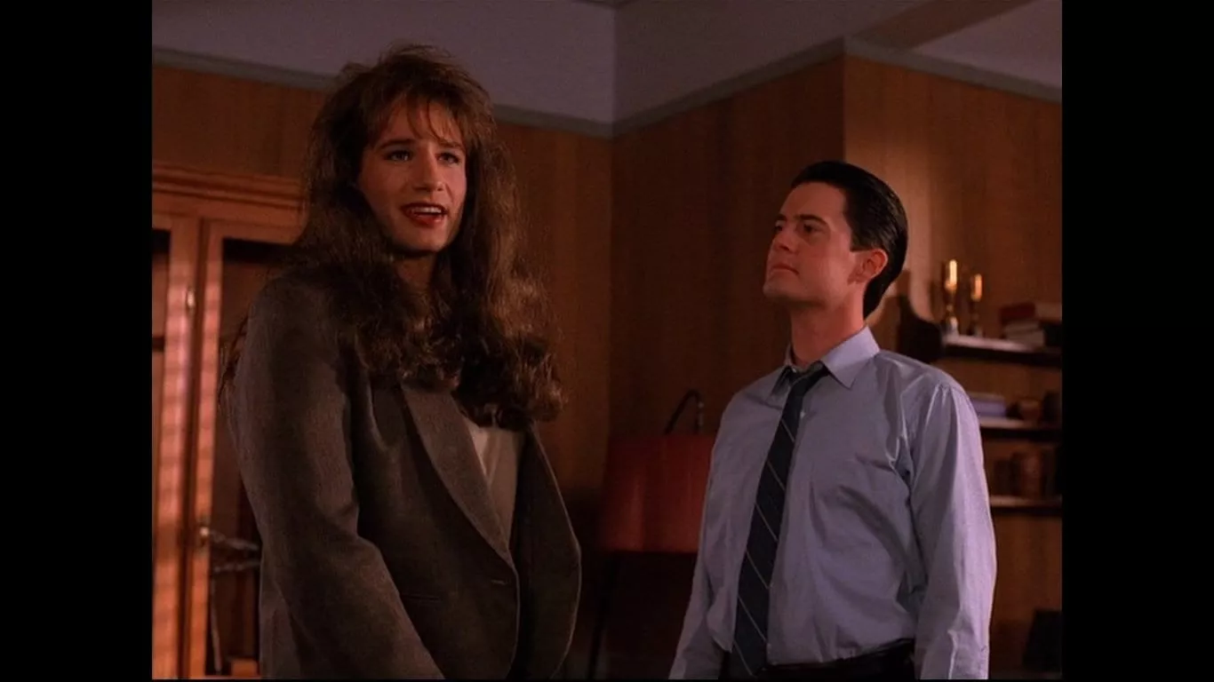 Denise stands next to Agent Cooper smiling