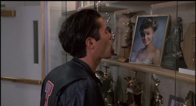 Bobby kisses the glass case holding Laura Palmers image