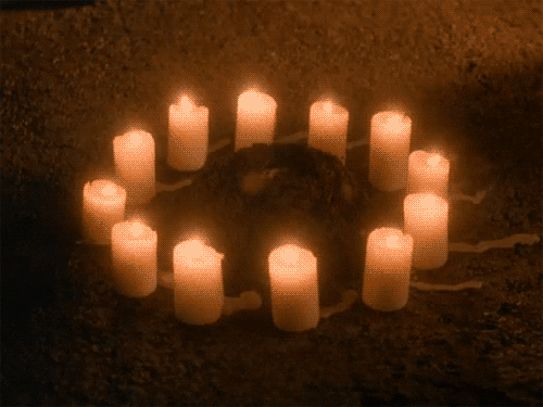 12 candles in a circle blow out in the wind