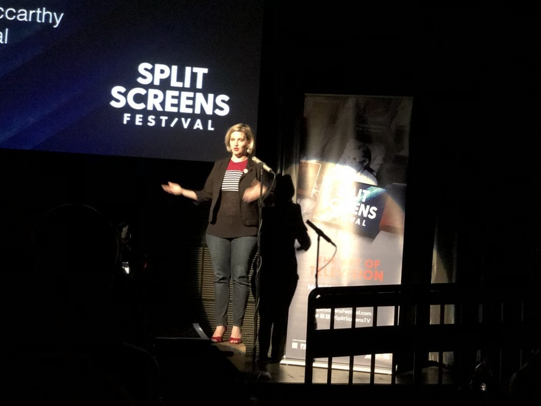 J.C. Hotchkiss stands on stage presenting at the 2018 Split Screens Festival