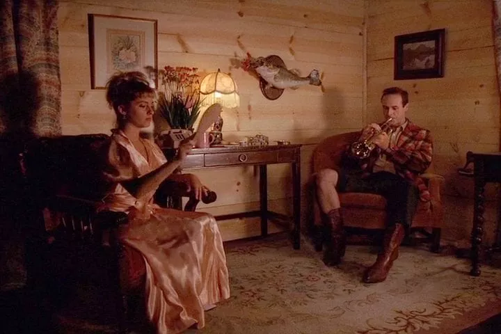 Lucy plays with a bat and ball, Andy plays a trumpet