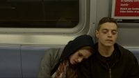 Darlene leans against Elliot's shoulder on the subway in Mr Robot