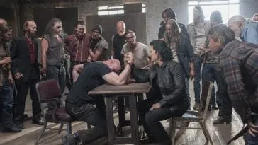 Evil Coop in an arm wrestling match