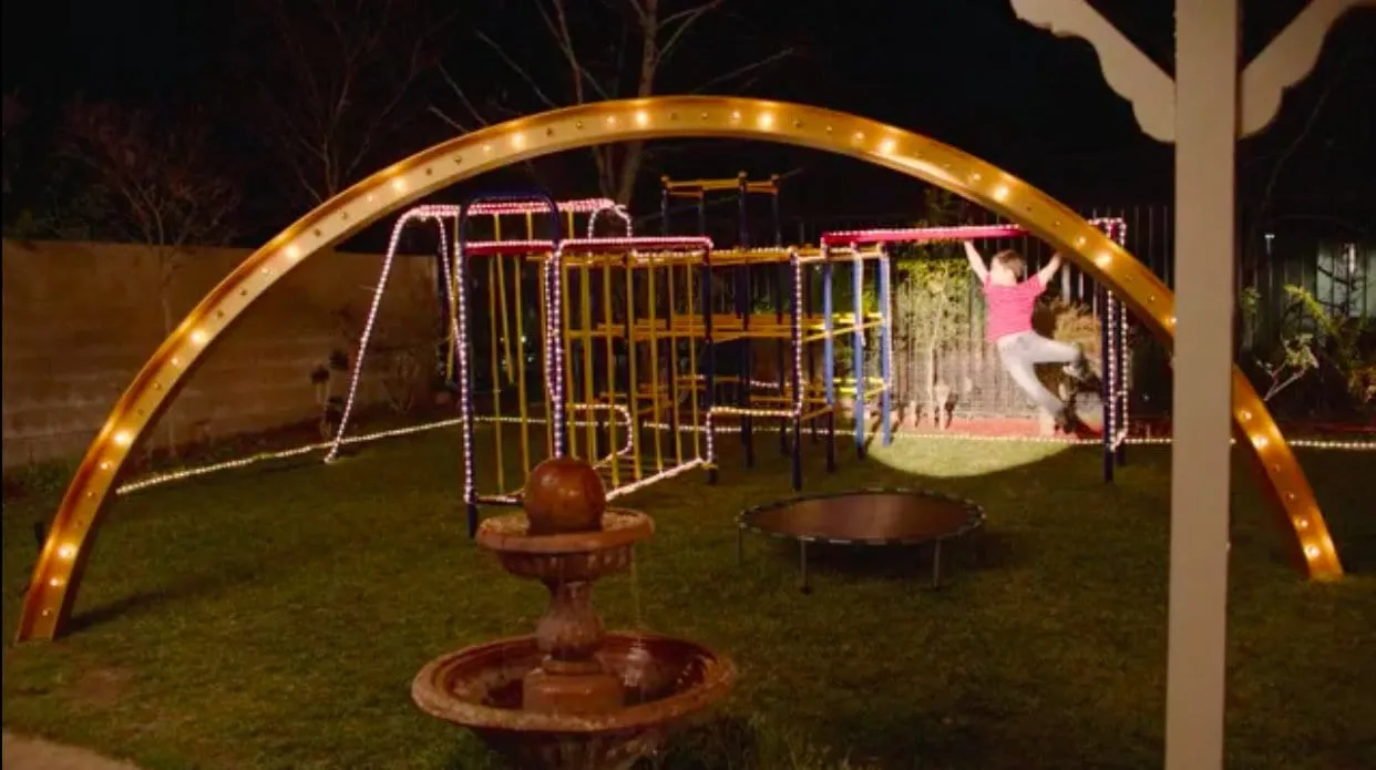 Sonny Jim plays with his gym set