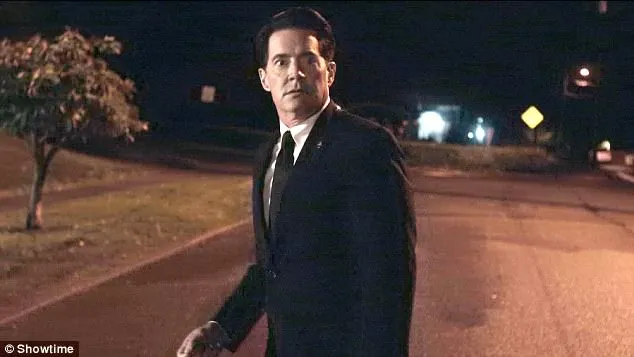 Dale Cooper in Part 18 on the street looking confused, after he went up to what he thought was the Palmer house.