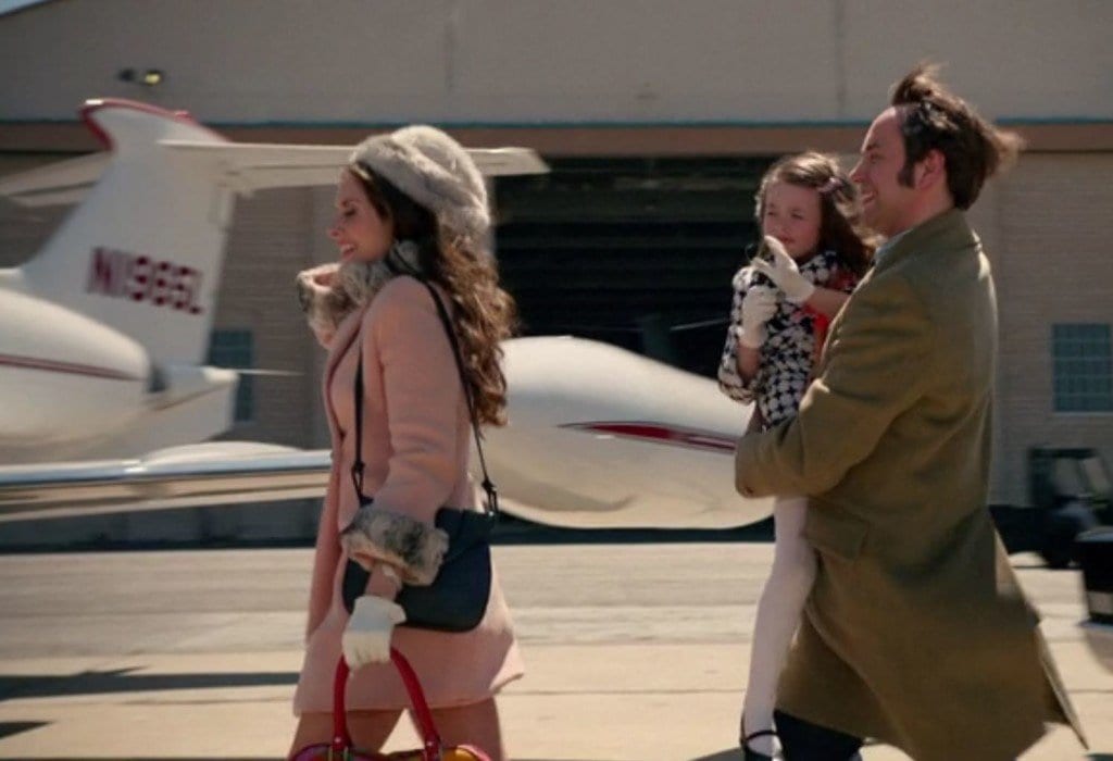 pete with his wife and child running for a plane