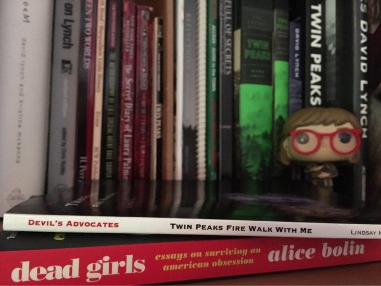 Twin Peaks books with a log lady funko pop figure