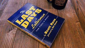 the last days of letterman book and a mug on a table
