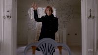 Codey throws thousands of pieces of paper in the air in AHS apocalypse