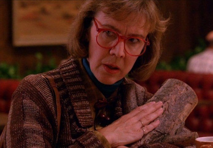 The Log Lady, with the log.