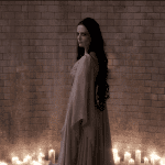 Vanessa (Eva Green) stands in an illuminated chamber as Ethan (Josh Harnett) approaches in the Penny Dreadful season 3 finale